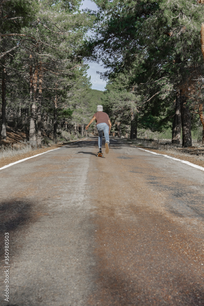 Skateboarding road mountain men Skateboarding road mountain men