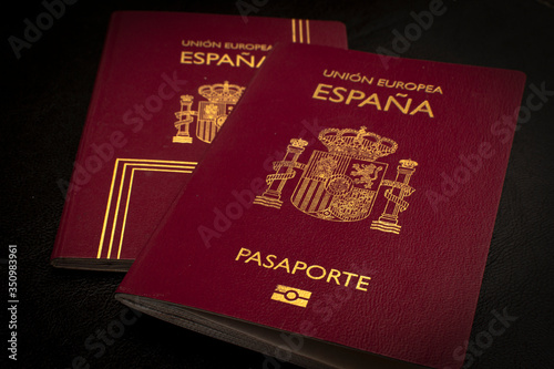 Buenos Aires, year 2020: Spain passport of the European Union. Travel documents. España country, spanish language. Black background.