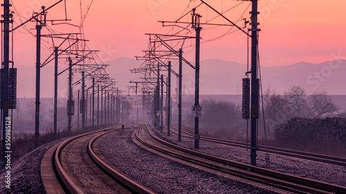 Railway into the light of a beautiful sunrise