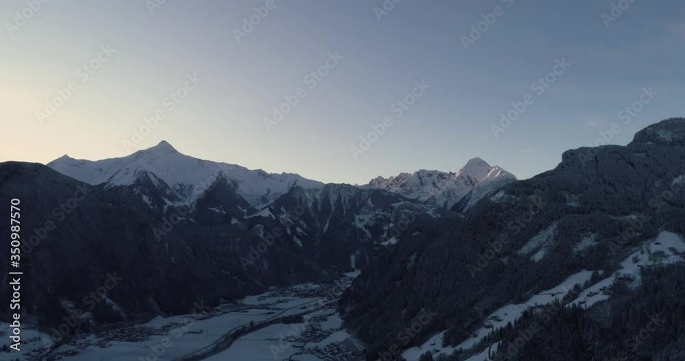 Austrian mountains at sunrise, sun hitting the tops of the mountains Austrian mountains at sunrise, sun hitting the tops of the mountains
