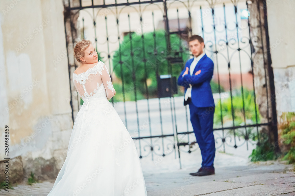 Fototapeta premium happy romantic young couple celebrating their marriage