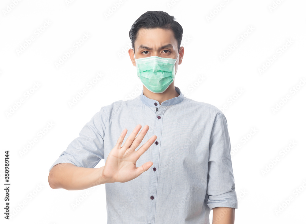 Young Asian businessman wearing hygienic mask gesturing stop to prevent infection, 2019-nCoV or coronavirus. Airborne respiratory illness such as pm 2.5 fighting and flu isolated on white background. Young Asian businessman wearing hygienic mask gesturing stop to prevent infection, 2019-nCoV or coronavirus. Airborne respiratory illness such as pm 2.5 fighting and flu isolated on white background.