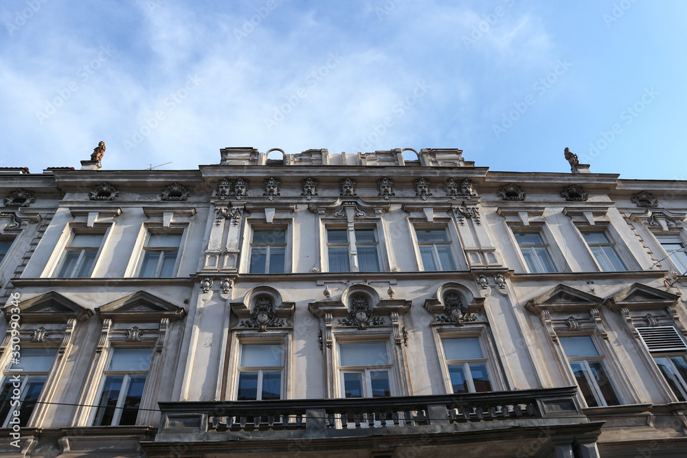 Zagreb/Croatia-April 21st,2020: Facade of old building in city center damaged by strong earthquake that broke part of the roof and decoration off to the ground