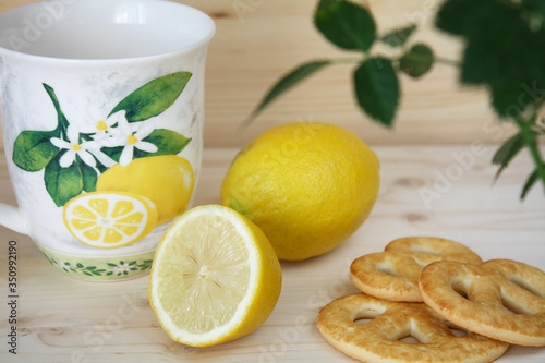 Wallpaper Mural Cup, cookie and lemon on a wooden table Torontodigital.ca