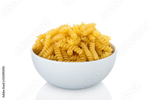 Girandole. Girandole pasta in white bowl, on white background (Tr- makarna)
