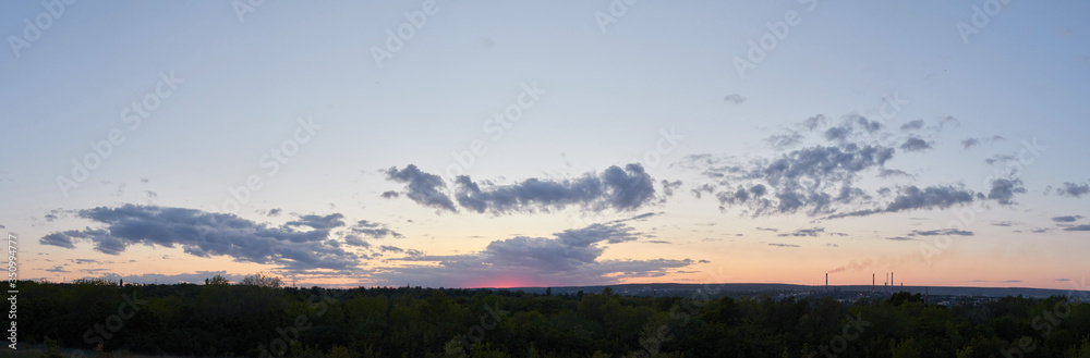 Panorama of the evening sunset. Sky sunset background panorama concept