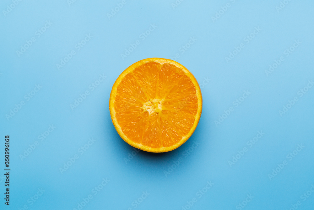 Slice of orange on blue background Slice of orange on blue background