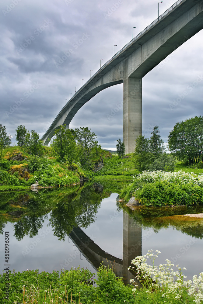 Fototapeta premium The Saltstraumen Bridge is a cantilever box girder bridge that crosses the Saltstraumen strait between the islands of Knaplundsoya and Straumoya in Bodo Municipality in Nordland county, Norway.
