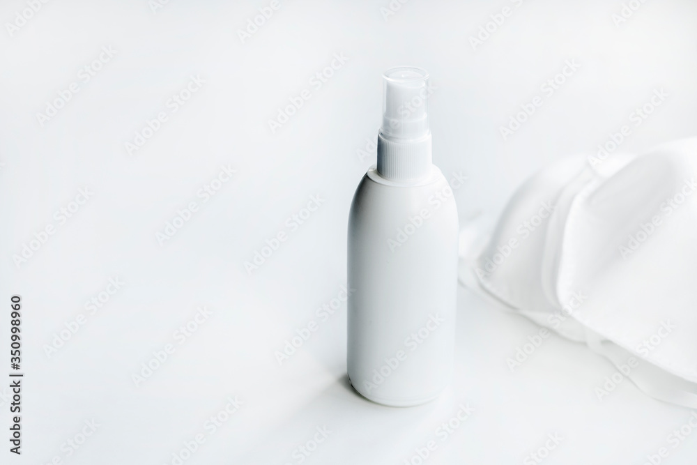 bottle of cologne and protective mask on white background bottle of cologne and protective mask on white background