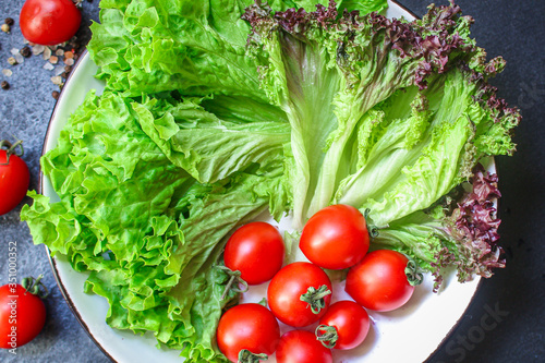 salad vegetables, lettuce and tomato Menu concept healthy eating. food background top view copy space for text healthy eating table setting keto or paleo diet organic