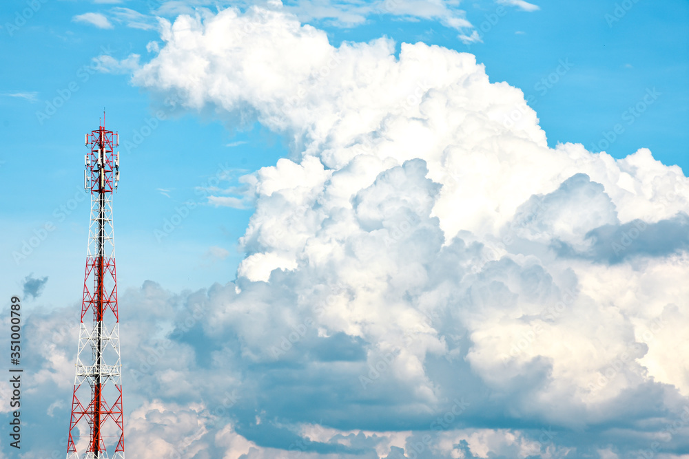 Telecommunication tower with beautiful blue sky with clouds. Anime sky clouds, anime style. Dramatic white clouds and sunlight. Sky background for animation or designer. Telecommunication tower with beautiful blue sky with clouds. Anime sky clouds, anime style. Dramatic white clouds and sunlight. Sky background for animation or designer.