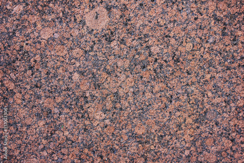 Granite stone texture background. Red granite rock pattern, empty rough wall structure close up. Mineral granite rock surface, blank natural element