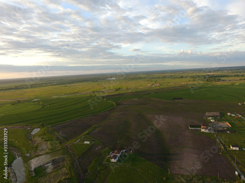 Aerial view of the saburb landscape (drone image). Near Kiev. Sunset time.