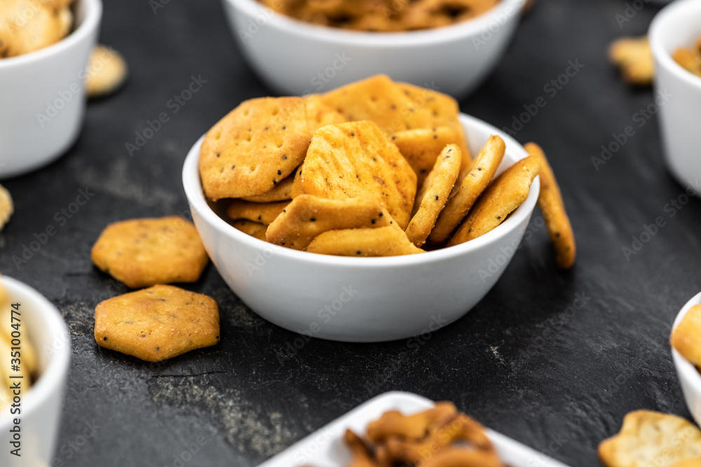 Mixed Snacks on dark background (close up shot; selective focus) Mixed Snacks on dark background (close up shot; selective focus)
