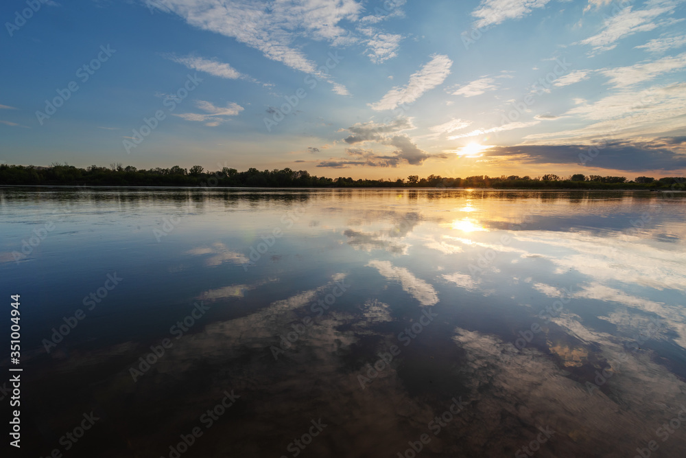 Fototapeta premium Beautiful evening on the river at sunset
