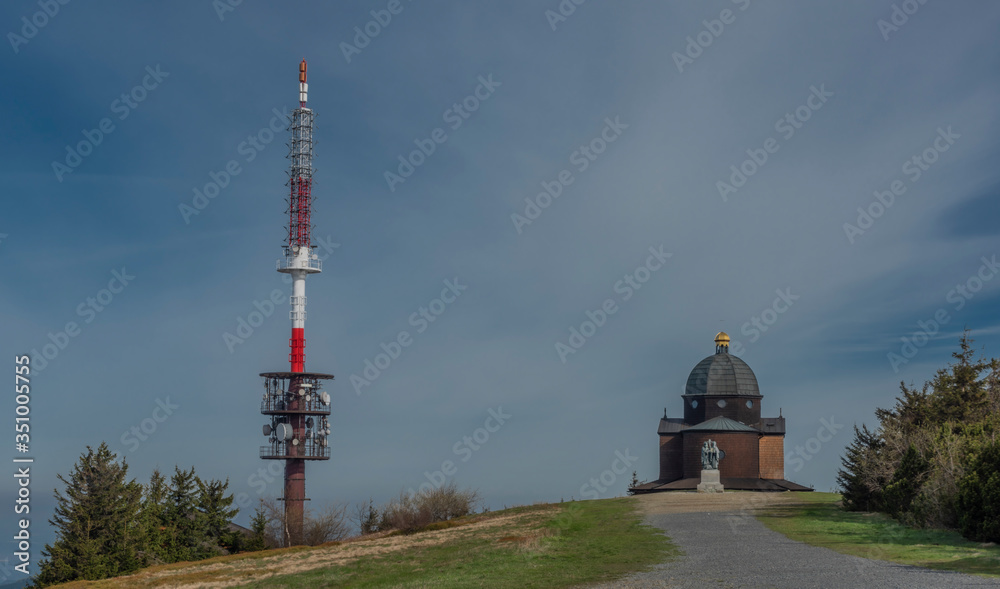 Obraz premium Brown wooden old chapel and transmitter on Radhost hill in Beskydy mountains