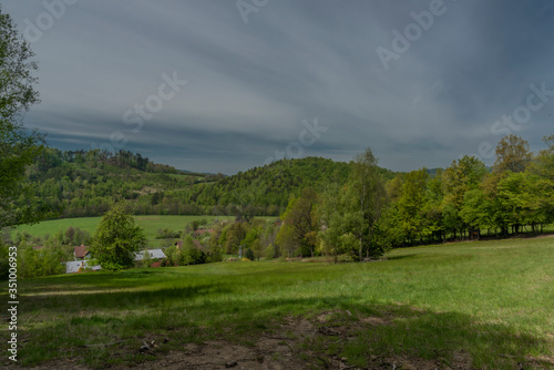 Green spring meadows near Dolni Becva village in Beskydy mountains