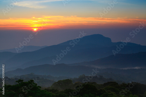 Foggy mountain landscape at early morning sunrise in Tiger Head Hill, Chiang Mai, Thailand, Thai people call , Doi Hua Seur