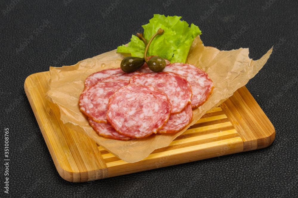 Spanish Salchichon sausage with salad Spanish Salchichon sausage with salad