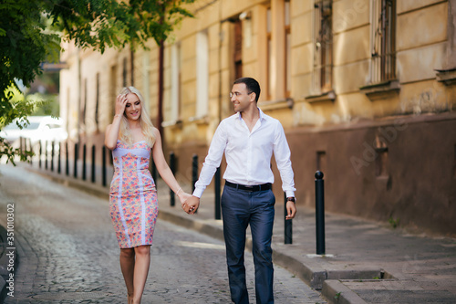 woman with her husband walking around the city, dressed neatly