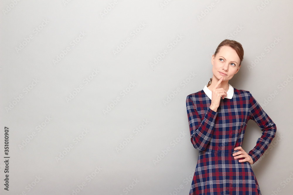 Portrait of thoughtful cute girl imagining something in mind Portrait of thoughtful cute girl imagining something in mind