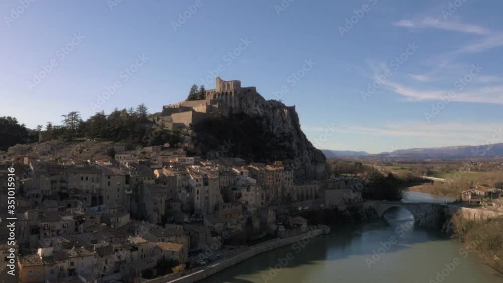 Flying away from beautiful town of Sisteron, France Flying away from beautiful town of Sisteron, France