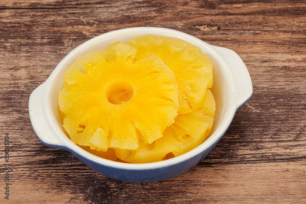Marinated pineapple rings in the bowl Marinated pineapple rings in the bowl