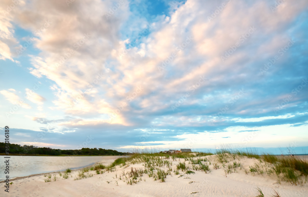 A beautiful sky behind a sand dune with sea oats on Pawleys Island in the low country of South Carolina.