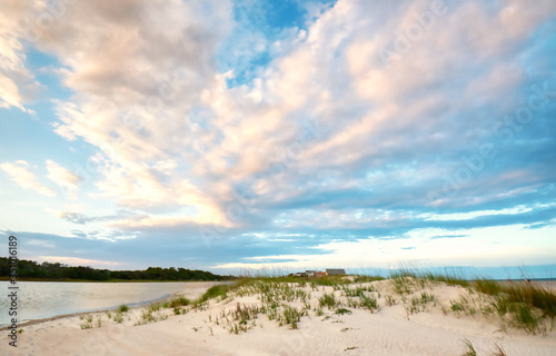 A beautiful sky behind a sand dune with sea oats on Pawleys Island in the low country of South Carolina.