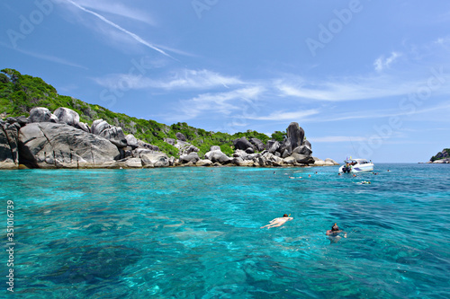 Tourists floating on the crystal-clear waters. Enjoy the beauty of the sea at Similan sea 