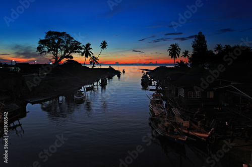 Beautiful sunrise Saphli Beach the view from the Tha Samet Bridge, Fishing village of Chumphon Thailand photo