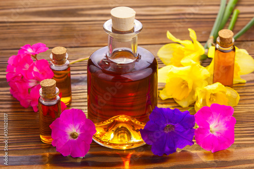 petunia essential oil in  beautiful bottle on table