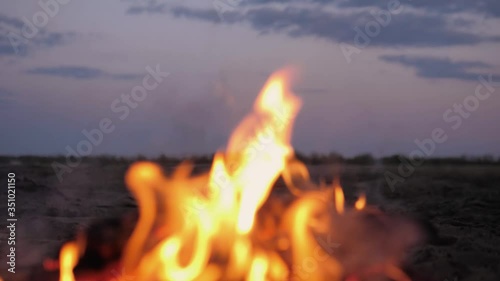 A bonfire burns. Close-up of flames. Summer evening. Slow motion.