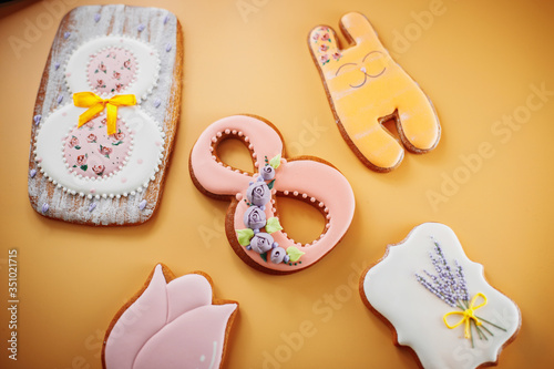 gingerbread cookies with different shapes on a yellow background