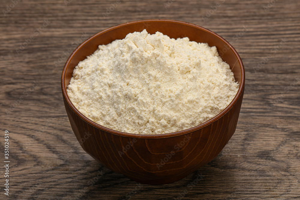 Wheat flour heap in the bowl