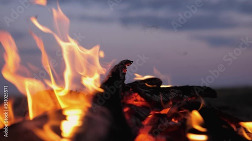 A bonfire burns. Close-up of flames. Summer evening. Slow motion.