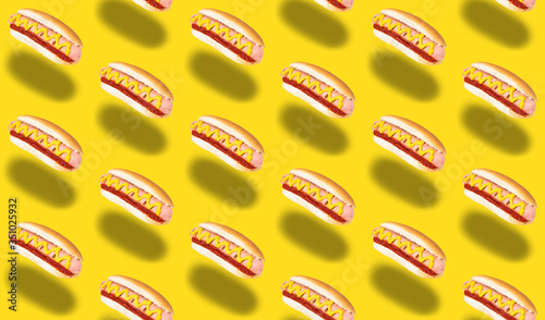 seamless pattern of hot dogs on yellow background