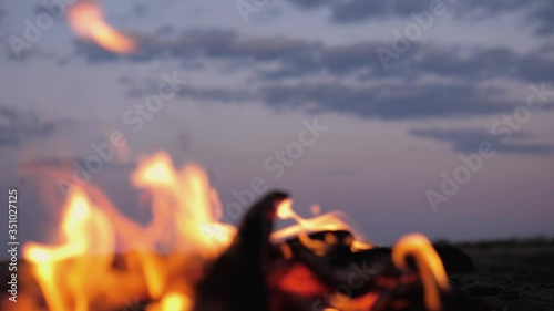 A bonfire burns. Close-up of flames. Summer evening. Slow motion.