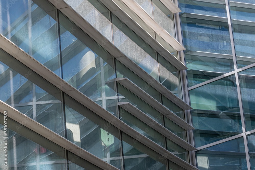 modern building facade fragment. Abstract architecture. Walls made of steel and glass with modern urban geometry. modern building facade fragment. Abstract architecture. Walls made of steel and glass with modern urban geometry.