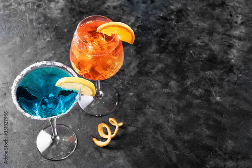 Refreshing summer drink blue lagoon cocktail and aperol spritz photo