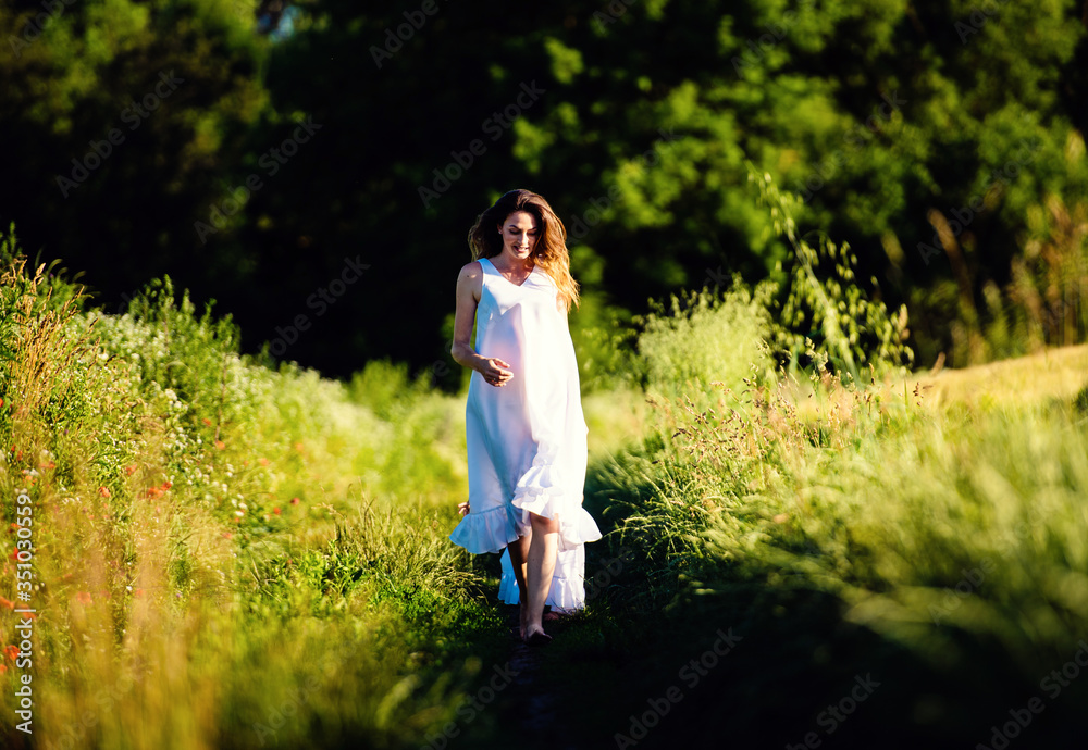 Beautiful woman in a field. Summer day. Beautiful woman in a field. Summer day.