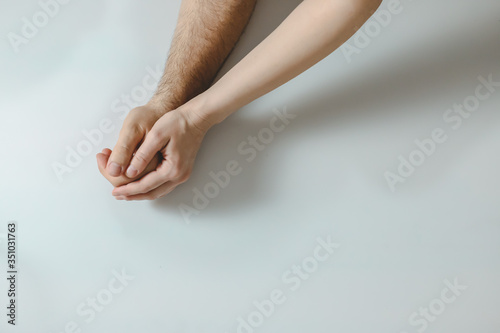 wife holding her husband's hand and supporting her