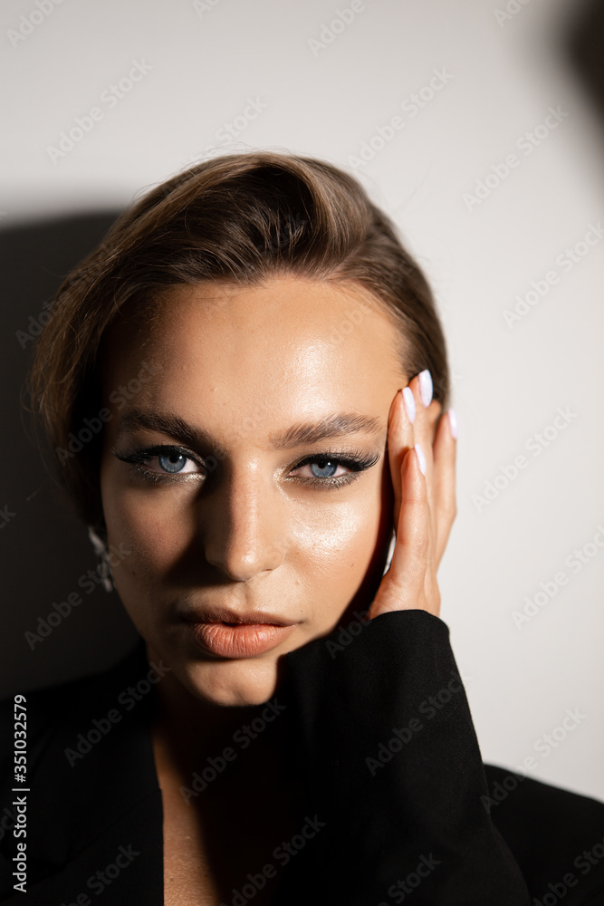 Portrait of a beautiful woman with makeup and styling. Blue eyes, fashionable eyebrows and beautiful lips. Portrait of a beautiful woman with makeup and styling. Blue eyes, fashionable eyebrows and beautiful lips.