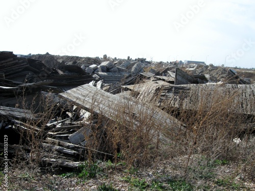 A wild landfill where various materials are deposited