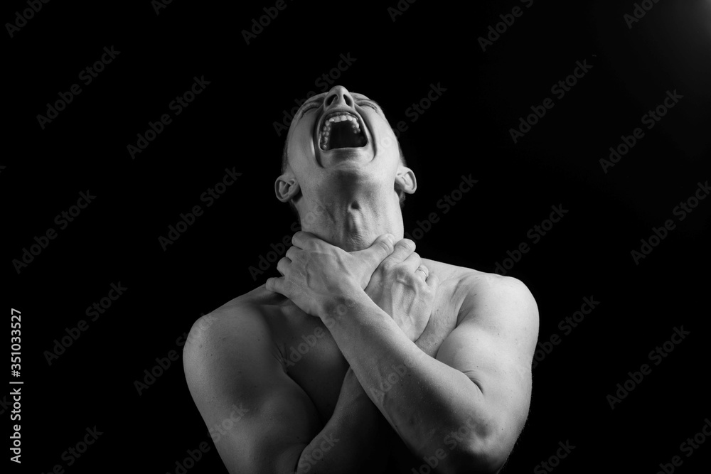 Φωτογραφία Black and white portrait of male athlete culture posing on black tone