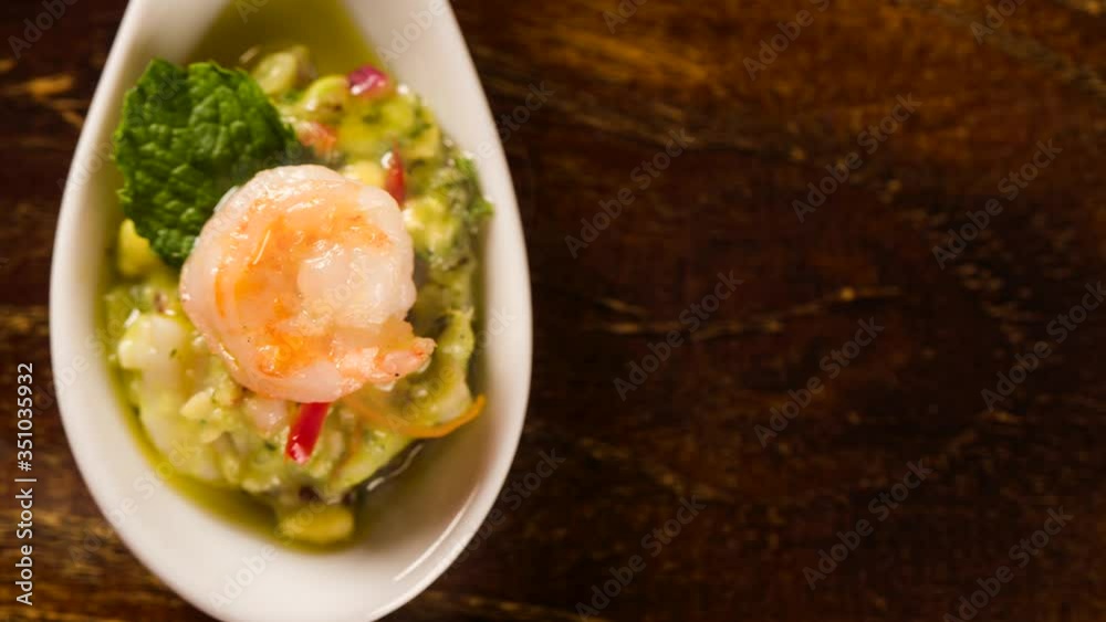 Shrimp Salad With Avocado in a spoon. Taste gastronomy finger food with smoke. Top view. Shrimp Salad With Avocado in a spoon. Taste gastronomy finger food with smoke. Top view.