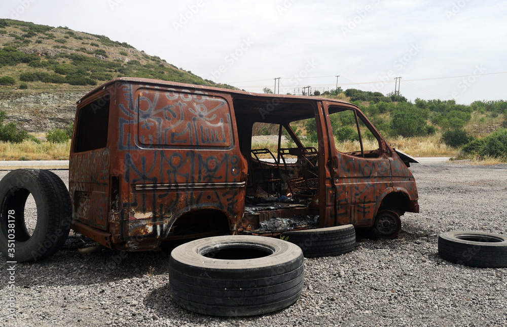 An abandoned burnt out car