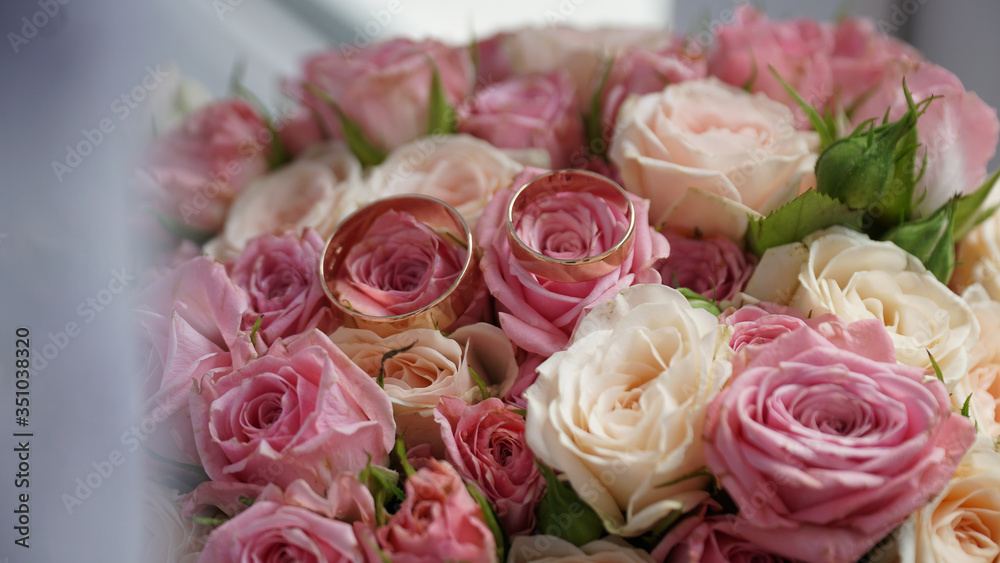 Bouquet of red and white roses and rings on flowers. Bouquet of red and white roses and rings on flowers.