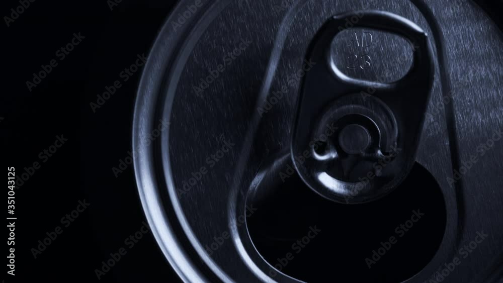 Top view of aluminum beverage can with beer or soda. Close-up rotating footage. Top view of aluminum beverage can with beer or soda. Close-up rotating footage.