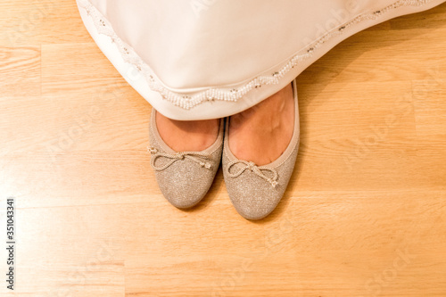 beige shoes and piece of dress